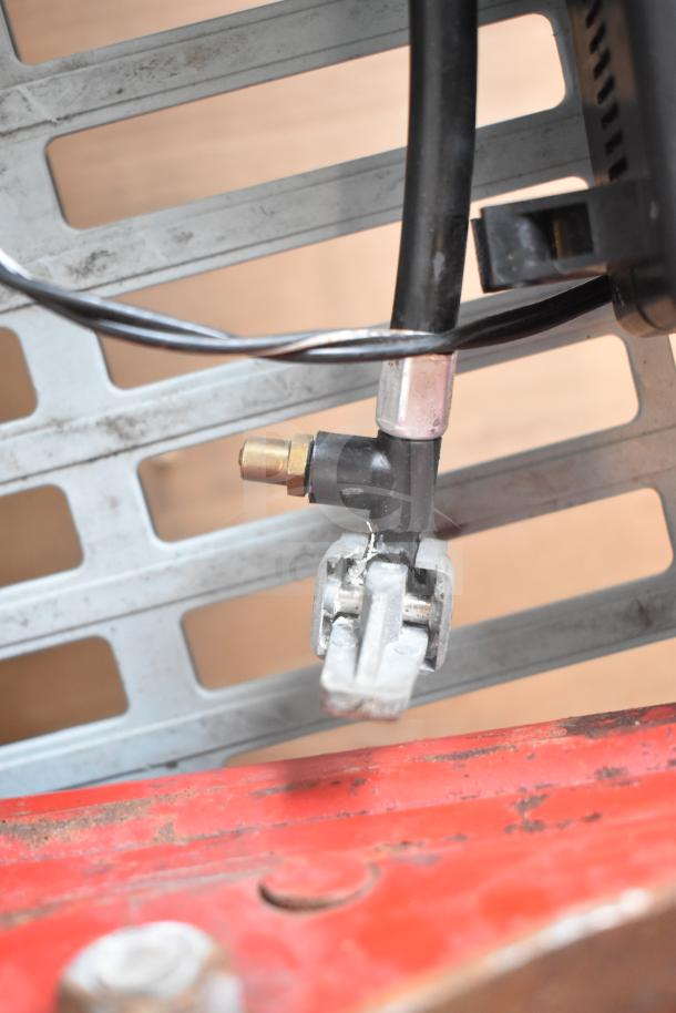 Max Power tire inflator compressor with hose and nozzle attachment, metal base. Includes hydraulic jack. Slight wear visible.