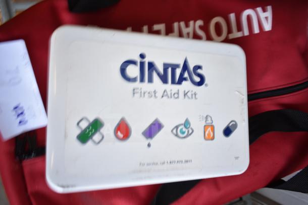 Cintas First Aid Kit, visible on red Auto Safety Kit bag; part of auction lot with Slime Tube Patch Kit, Tire Tackle.