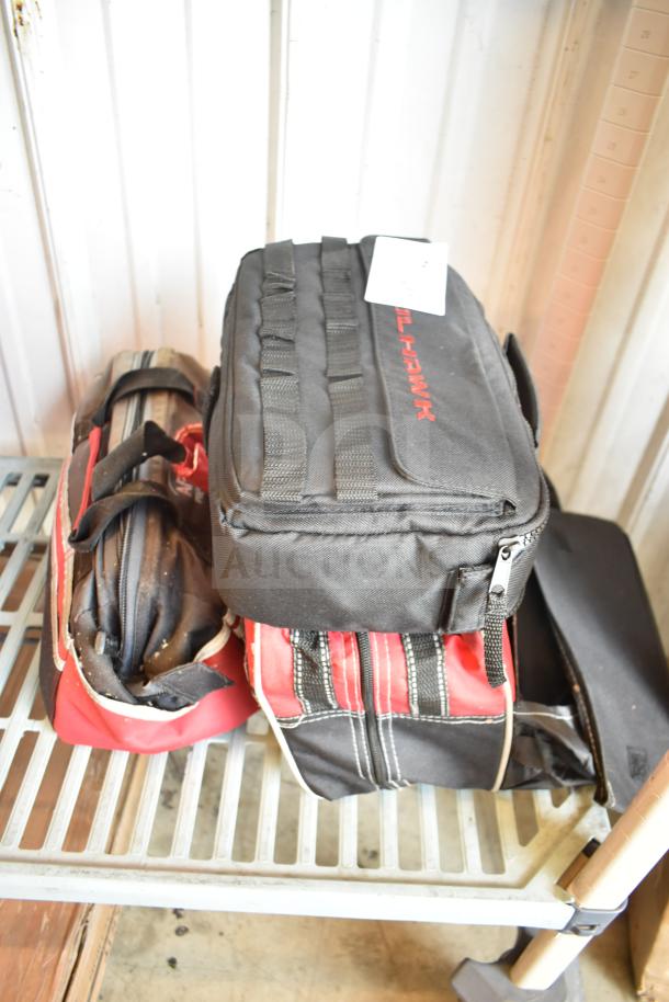 Three bags containing various items, including jumper cables. One bag labeled "BULL-HAWK." All bags in good condition.