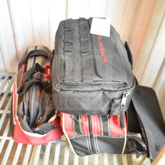 Three bags containing various items, including jumper cables. One bag labeled "BULL-HAWK." All bags in good condition.