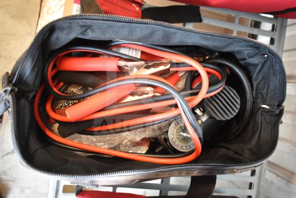 Black bag with red jumper cables and pressure gauge, shown in used condition. Auction lot of 3 items with varied contents.