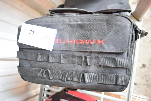 Black tactical bag with "Milhawk" logo in red, containing jumper cables, auction tag labeled "71 VMS."