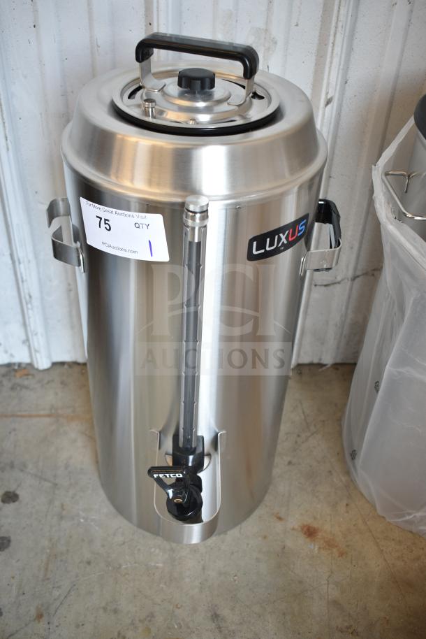 BRAND NEW Fetco TPD-30 Luxus 3 Gallon Coffee Dispenser, stainless steel, scratch and dent, visible Luxus label and auction tag.