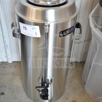 BRAND NEW Fetco TPD-30 Luxus 3 Gallon Coffee Dispenser, stainless steel, scratch and dent, visible Luxus label and auction tag.
