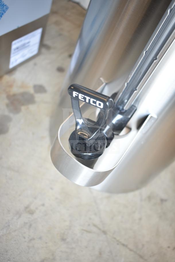 Brand new Fetco TPD-30 Luxus 3-gallon stainless steel coffee dispenser, noted as scratch and dent.