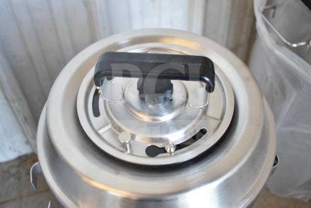 BRAND NEW SCRATCH AND DENT! Fetco TPD-30 Luxus 3 Gallon Coffee Dispenser, stainless steel, top handle visible.