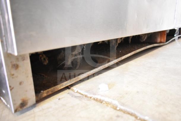 Delfield commercial sandwich salad prep table base with visible rust and wear. 115 Volts, 1 Phase, 4 drawers.