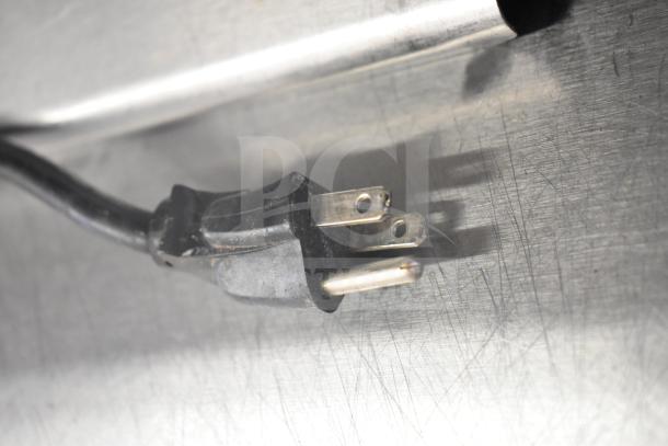 "Three-prong power cord plug for Delfield Commercial Sandwich Salad Prep Table, compatible with 115 Volts, 1 Phase."