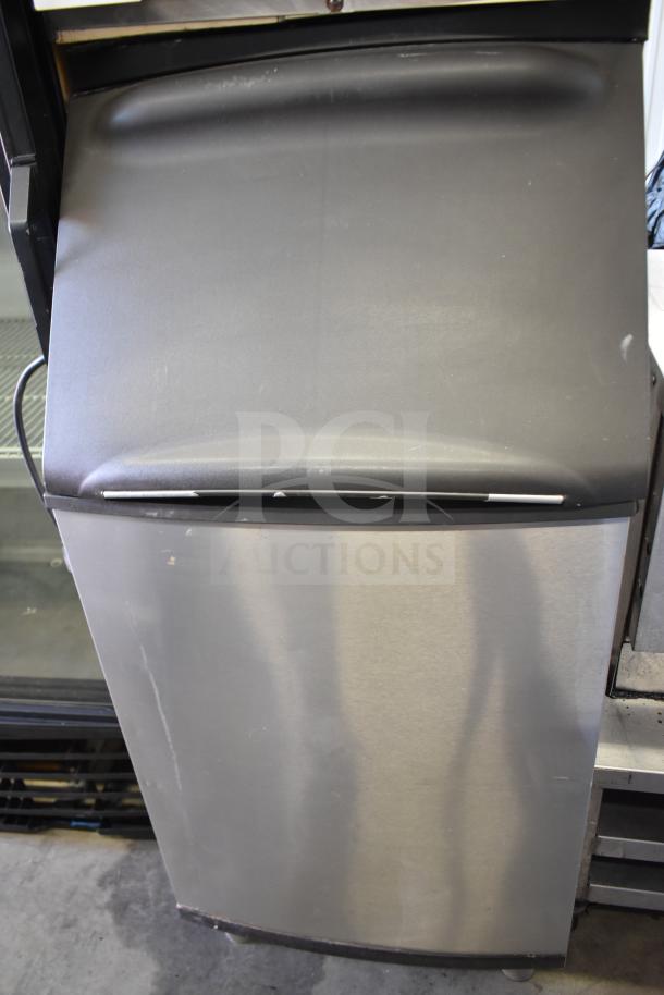 Hoshizaki ice head on Manitowoc B420 bin. Stainless steel, commercial use, minor wear, suitable for efficient ice production.