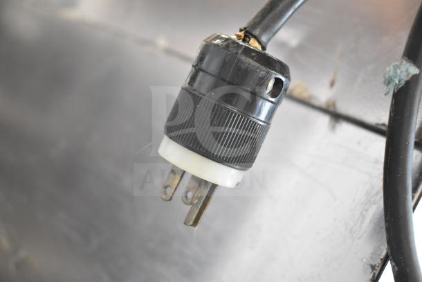 Power plug of Hoshizaki Commercial Ice Head on Manitowoc B420 Ice Bin, showcasing moderate wear.