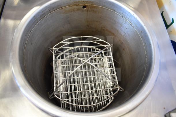 2021 Winston PF56C11SJ commercial electric fryer with stainless basket. Used, showing signs of wear. 208 Volts, 1 Phase.