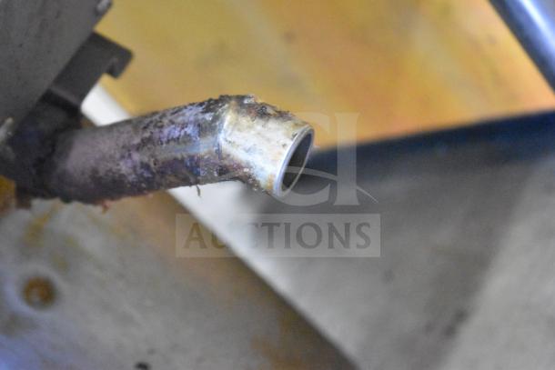 2021 Winston CollectraMatic PF56C11SJ fryer drain pipe close-up, showing rust and signs of use.