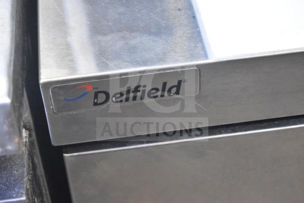 Delfield UCD4464N-12-DD5 commercial prep table with 4 drawers, Bain Marie mega top. Visible branding label. 115V, 1 phase.