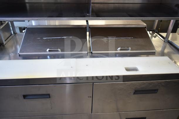 Delfield UCD4464N-12-DD5 commercial prep table with 4 drawers, stainless steel finish, Bain Marie top, used condition.