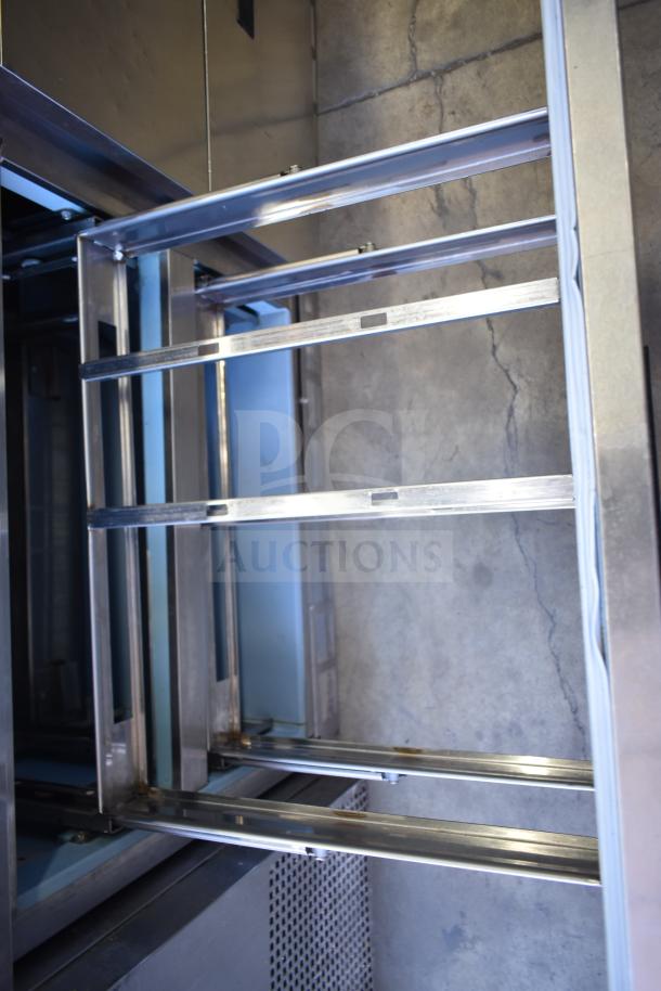 Delfield UCD4464N-12-DD5 commercial prep table frame. Visible drawer slides, stainless structure, used condition.