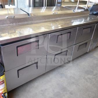 True TPP-93D-6 commercial pizza prep table with 6 drawers, stainless steel, on commercial casters, used condition.