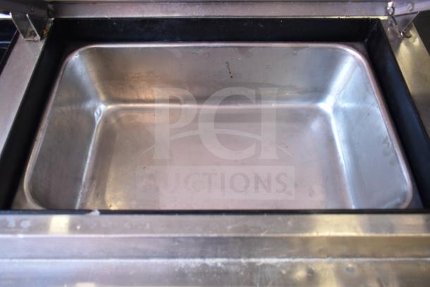 True TPP-93D-6 commercial pizza prep table, stainless interior, 6 drawers, commercial casters, 115V, used condition.
