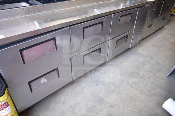 True TPP-93D-6 commercial pizza prep table with six drawers, stainless steel, on commercial casters, 115 volts, 1 phase.