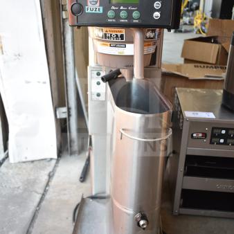 Bunn Commercial Iced Tea Machine with beverage holder, 120V, 1 phase. Features digital controls, warning labels, and sturdy build.