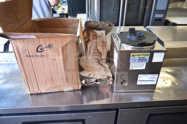 Curtis GEM3IF 1.5 Gallon Satellite Coffee Server with IntelliFresh, stainless steel, original box, caution label visible.