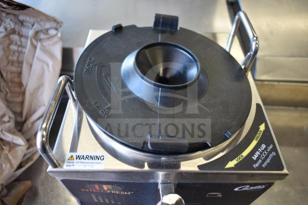 Curtis GEM3IF 1.5 Gallon Satellite Coffee Server with IntelliFresh, black lid, safety lock feature, and warning label visible.