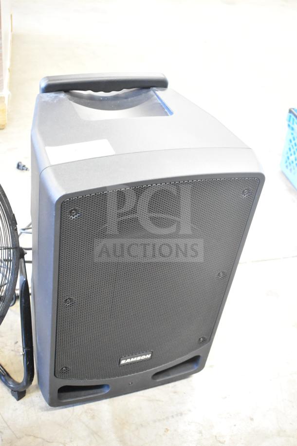 Samson Expedition XP312w Portable PA System, black, sturdy build, visible handle, brand logo on grille, good condition.