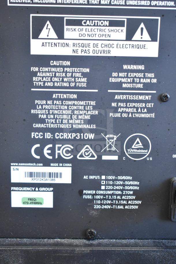Back panel of Samson Expedition XP312w PA System, showing caution labels, FCC ID CCRXP310W, and frequency 470-494 MHz.