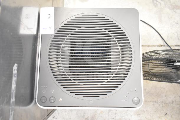Coway Airmega air purifier, top view, in good condition. Features control buttons, 120V, 1 Phase. Auction lot label visible.