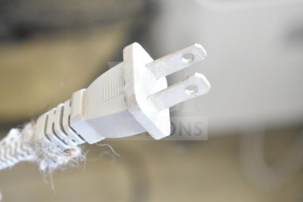 Power plug of Coway Airmega Air Purifier. Shows 120V, 1 Phase. Slight wear visible on the plug and cord.