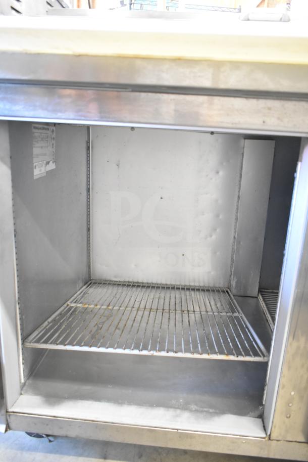 Beverage Air DP93 Commercial Pizza Prep Table, stainless steel, 115 volts, 1 phase. Interior in used condition with wire shelf.