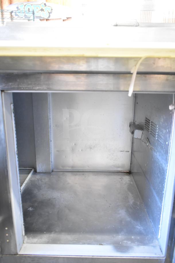Beverage Air DP93 commercial pizza prep table, stainless steel interior, used condition, 115 volts, 1 phase.