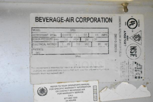 Beverage-Air DP93 commercial pizza prep table label showing specs: 115V, 1 phase, R134a refrigerant, 8.6 amps.