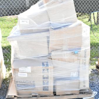Pallet with brand new, scratch and dent items including containers and hood filters. Visible labels indicate fragile contents.