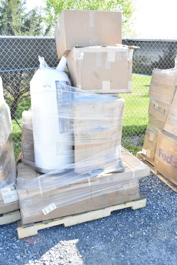 Pallet with 12 assorted brand new scratch and dent items, including motor assembly and wok, wrapped in plastic.