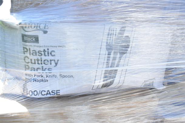 Wrap-bound box labeled "Choice Black Plastic Cutlery Packs," featuring forks, knives, spoons, and napkins, 100 per case.