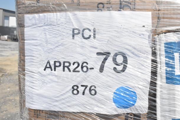 Plastic-wrapped pallet with visible label stating "PCI APR26-79 876," likely containing new scratch and dent items.