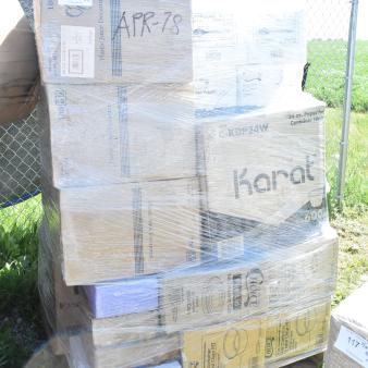 Pallet with 33 brand new scratch and dent items, including a work table. Boxes labeled "APR-78", wrapped in plastic.