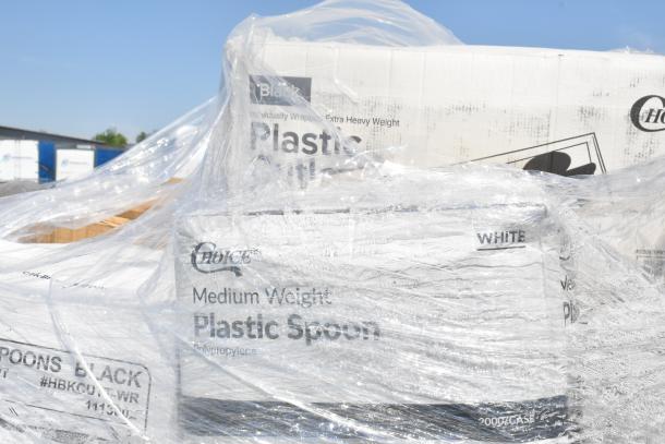 Plastic-wrapped pallets containing boxes marked "Choice Medium Weight Plastic Spoon," condition appears new.