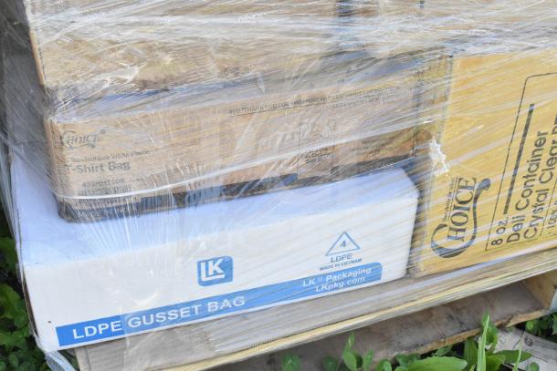 Pallet of 33 scratch and dent items, including work table and LDPE gusset bags, in original packaging with visible brand labels.