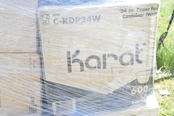 Pallet of Karat 24 oz. paper food containers wrapped in plastic. Visible label reads "C-KDP24W" and "600 ct, 24 oz."