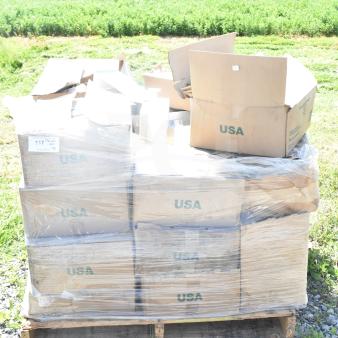 Pallet of brand new scratch and dent items, including coffee cup collars, straws, and WBS-13 bags. Labeled "USA."