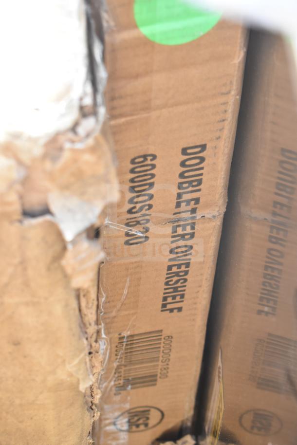 Cardboard box for Regency double tier overshelf, model 600DOS1830, with visible barcode and minor wear.