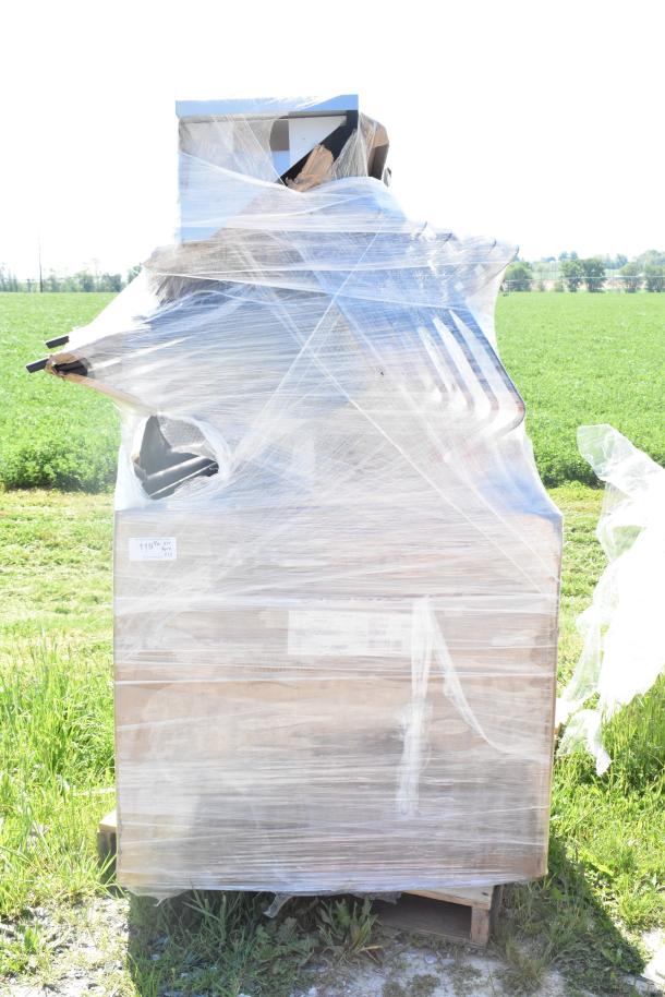 Plastic-wrapped pallet with multiple items, including a chef base drawer and armchair. New condition with minor scratches.
