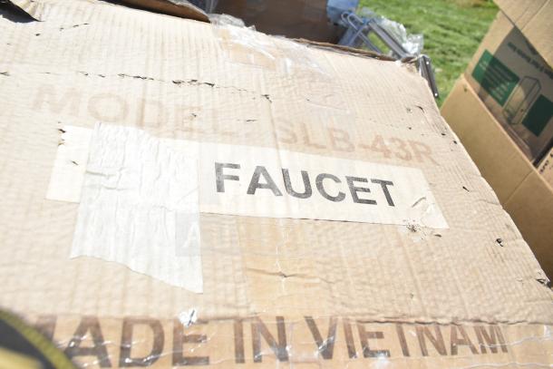 Cardboard box labeled "Faucet," marked "Model SLB-43R," shows wear. Part of a lot of 20 scratch and dent items.