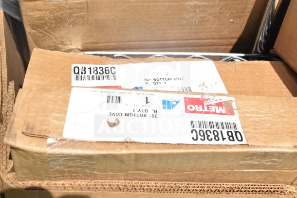 Cardboard boxes with labels showing item codes "QB1836C," containing new scratch and dent items like sink and shelves.