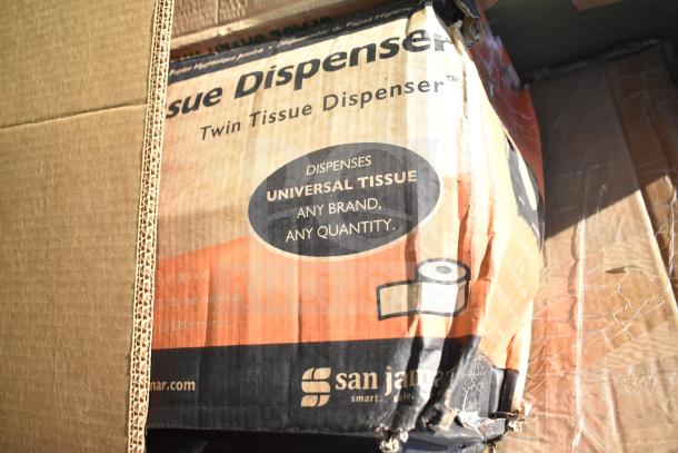 Cardboard box containing San Jamar twin tissue dispenser, universal tissue compatible, shows scratch and dent condition.