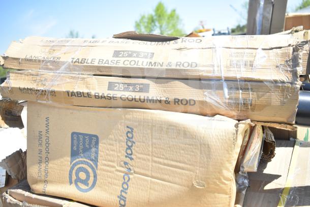 Boxes of scratch and dent items including Lancaster table base columns and Robot Coupe products, slightly damaged packaging.