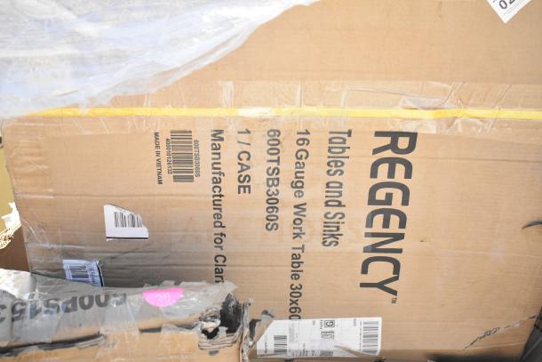 Brand new Regency 16-gauge work table in damaged packaging, model 600TSB3060S. Includes griddle top and more. Made in Vietnam.