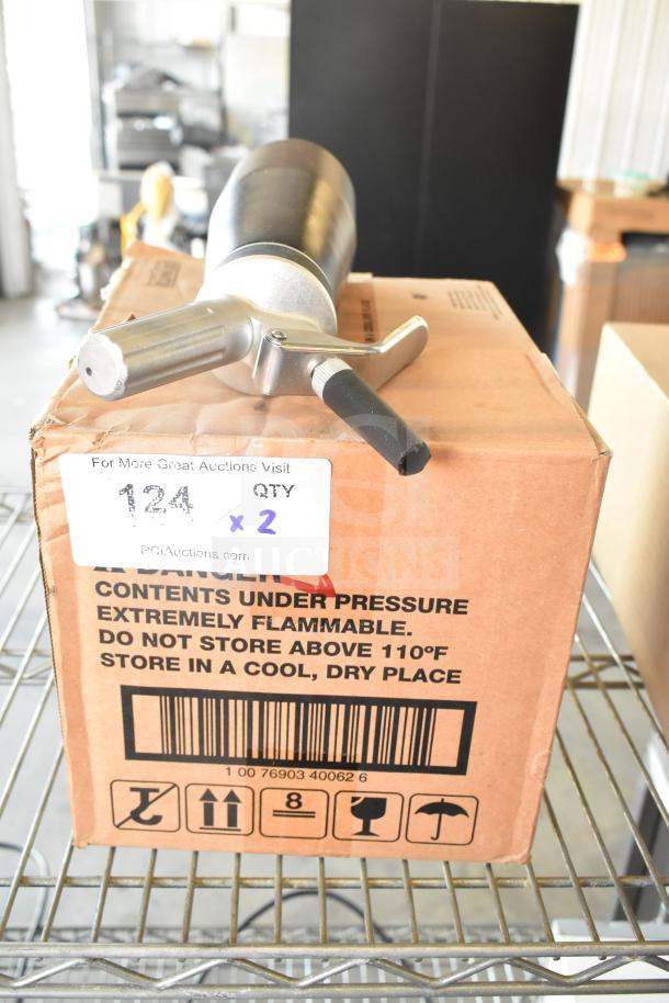 Box of butane fuel cans and whipped cream dispenser on warehouse shelf. Label: "Contents under pressure; flammable." Quantity x2.