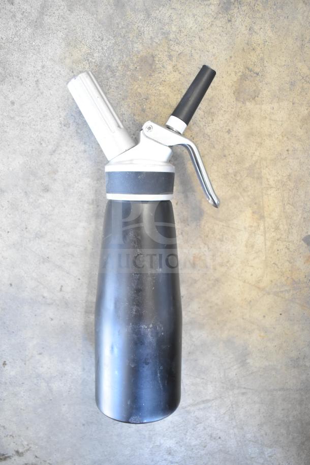 Whipped cream dispenser, black and silver, metal with plastic nozzle, includes box of butane fuel cans.
